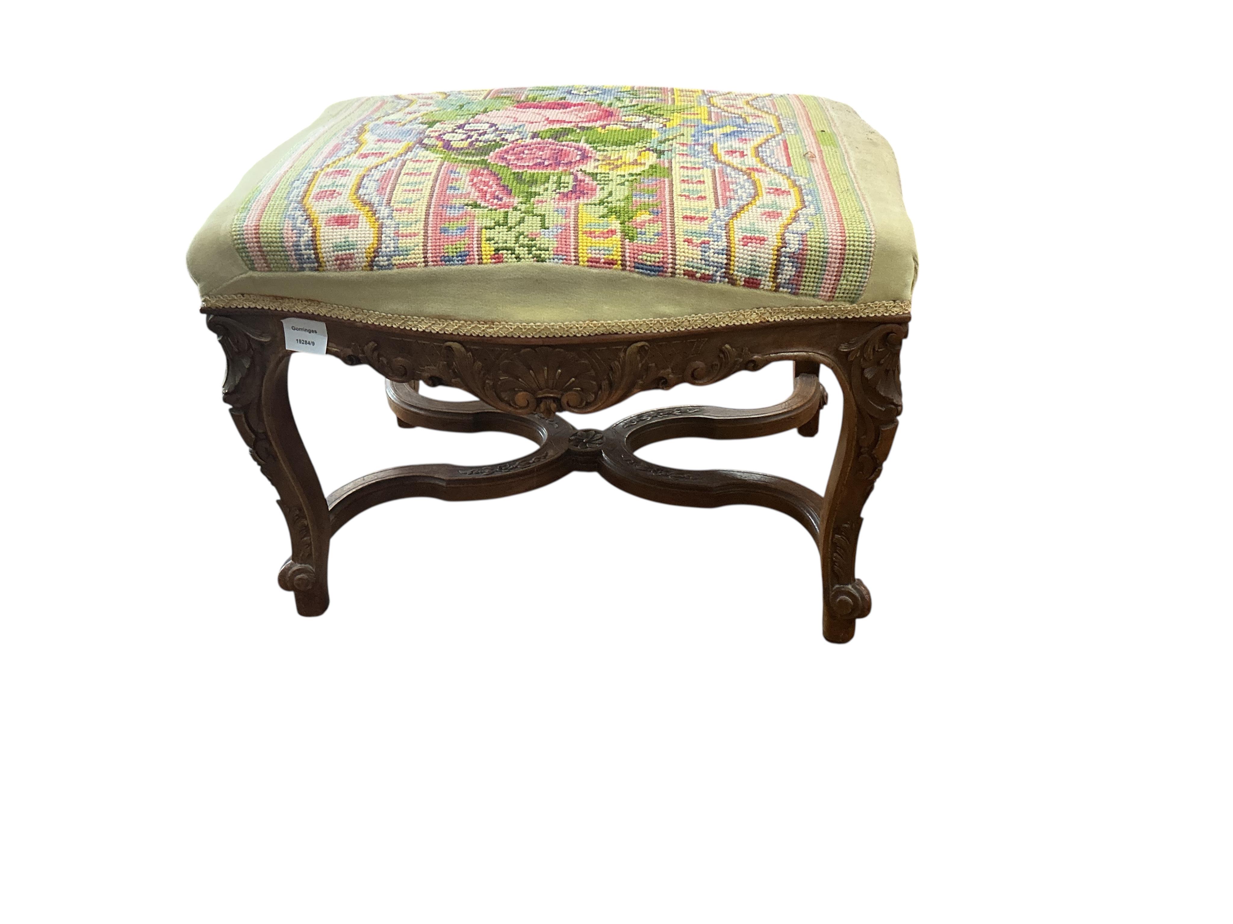 A 19th century French carved walnut dressing stool, with a tapestry upholstered top, width 62cm, depth 48cm, height 44cm